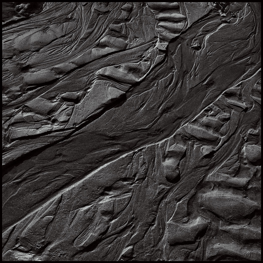 Photographie numérique du sable en noir et blanc